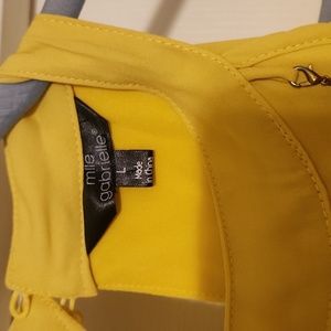 A yellowish mustard colored cold shoulder dress size L by mlle Gabrielle  $21